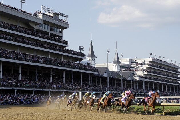 Horses make their way around turn one during the 141st running of the Kentucky Derby horse race at Churchill Downs Saturday, May 2, 2015, in Louisville, Ky. (AP Photo/Darron Cummings)