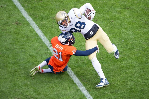 ATLANTA, GA - NOVEMBER 1: Wide receiver Darren Waller #88 of the Georgia Tech Yellow Jackets attempts to escape a tackle by safety Brandon Phelps #21 of the Virginia Cavaliers on November 1, 2014 at Bobby Dodd Stadium in Atlanta, Georgia. The Georgia Tech Yellow Jackets defeated the Virginia Cavaliers 35-10. (Photo by Michael Chang/Getty Images)
