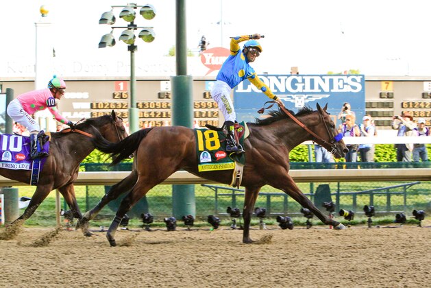 IMAGE DISTRIBUTED FOR LONGINES - Jockey Victor Espinoza, on American Pharaoh, celebrates his third Kentucky Derby victory at the 141st running of the Kentucky Derby, Saturday, May 2, 2015, at Churchill Downs in Louisville, Ky.  Longines, the Swiss watch manufacturer known for its elegant timepieces, is the Official Watch and Timekeeper of the 141st annual Kentucky Derby.   (Invision for Longines/AP Images)