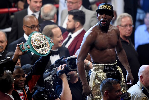LAS VEGAS, NV - MAY 02: Floyd Mayweather Jr. celebrates the unanimous decision victory during the welterweight unification championship bout on May 2, 2015 at MGM Grand Garden Arena in Las Vegas, Nevada.  (Photo by Harry How/Getty Images)