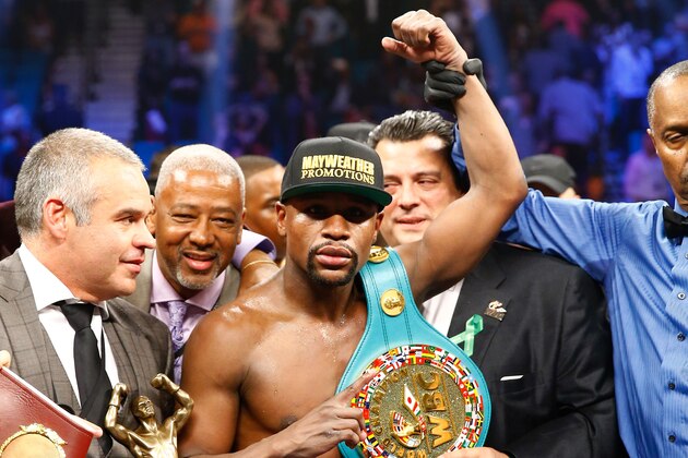 LAS VEGAS, NV - MAY 02:  Floyd Mayweather Jr. celebrates the unanimous decision victory during the welterweight unification championship bout on May 2, 2015 at MGM Grand Garden Arena in Las Vegas, Nevada.  (Photo by Al Bello/Getty Images)
