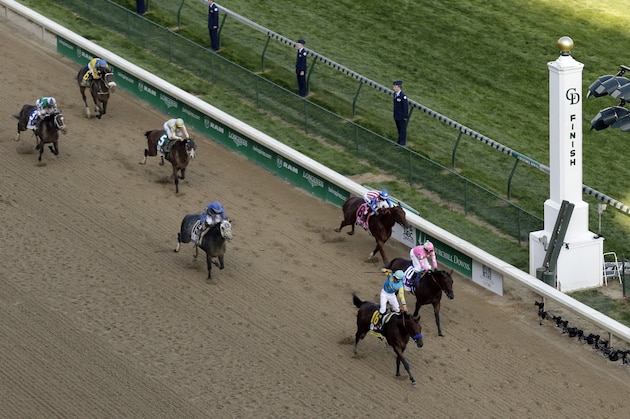 Victor Espinoza rides American Pharoah to victory in the 141st running of the Kentucky Derby horse race at Churchill Downs Saturday, May 2, 2015, in Louisville, Ky. (AP Photo/Charlie Riedel)
