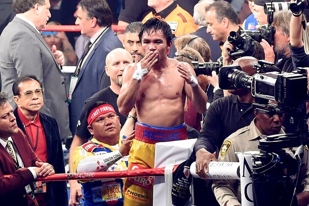LAS VEGAS, NV - MAY 02:  Manny Pacquiao gestures to the crowd after losing to Floyd Mayweather Jr. by unanimous decision in their welterweight unification championship bout on May 2, 2015 at MGM Grand Garden Arena in Las Vegas, Nevada.  (Photo by Jason Merritt/Getty Images)