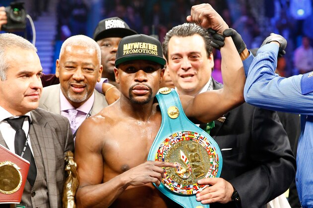 LAS VEGAS, NV - MAY 02:  Floyd Mayweather Jr. celebrates the unanimous decision victory against Manny Pacquiao in their welterweight unification championship bout on May 2, 2015 at MGM Grand Garden Arena in Las Vegas, Nevada.  (Photo by Al Bello/Getty Images)