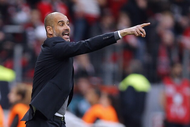 Bayern's head coach Pep Guardiola gestures  during the German first division Bundesliga soccer match between Bayer 04 Leverkusen and Bayern Munich in Leverkusen, Germany, Saturday, May 2, 2015. (AP Photo/Frank Augstein)