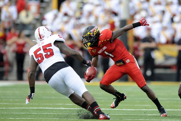 Maryland wide receiver Stefon Diggs (1) runs with the ball against North Carolina State defensive end Brian Slay (55) during the first half of an NCAA college football game, Saturday, Oct. 20, 2012, in College Park, Md. (AP Photo/Nick Wass)