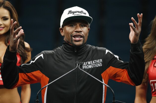 Floyd Mayweather Jr. gestures during a press conference following his welterweight title fight on Saturday, May 2, 2015 in Las Vegas. Mayweather defeated Manny Pacquiao in a unanimous decision. (AP Photo/John Locher)
