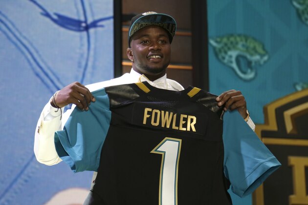 Dante Fowler stands on stage after being drafted third by Jacksonville in the first round of the 2015 NFL Draft, Thursday, April 30, 2015, in Chicago.  (Jeff Haynes/AP Images for Panini)