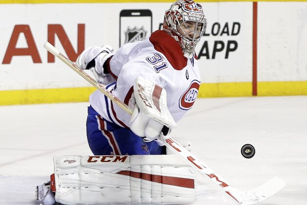 Montreal Canadiens goalie Carey Price blocks a shot against the Nashville Predators in the third period of an NHL hockey game Tuesday, March 24, 2015, in Nashville, Tenn. The Predators won in overtime 3-2. (AP Photo/Mark Humphrey)
