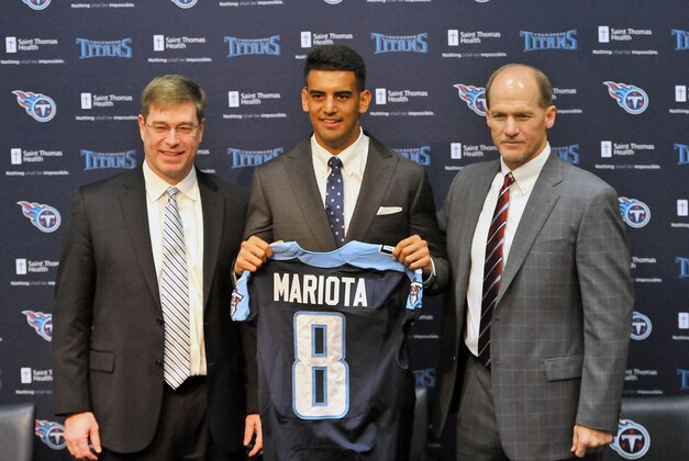 May 1, 2015; Nashville, TN, USA; Tennessee Titans first round draft pick Marcus Mariota (C) stands with executive vice president and general manager Ruston Webster (L) and head coach Ken Whisenhunt (R) during the press conference at Saint Thomas Sports Park. Mandatory Credit: Jim Brown-USA TODAY Sports