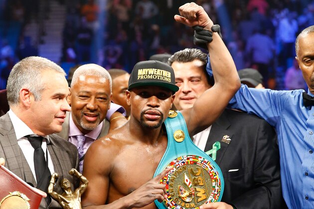 LAS VEGAS, NV - MAY 02:  Floyd Mayweather Jr. celebrates the unanimous decision victory during the welterweight unification championship bout on May 2, 2015 at MGM Grand Garden Arena in Las Vegas, Nevada.  (Photo by Al Bello/Getty Images)