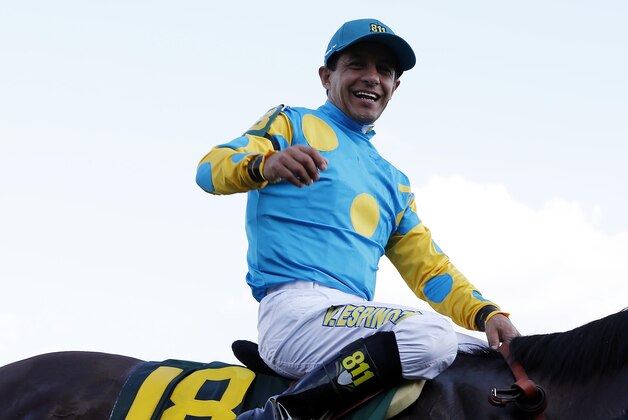May 2, 2015; Louisville, KY, USA; Victor Espinoza aboard American Pharoah celebrates winning the 141st Kentucky Derby at Churchill Downs. Mandatory Credit: Brian Spurlock-USA TODAY Sports