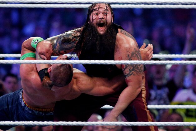 John Cena, left, and Bray Wyatt, right, compete during Wrestlemania XXX at the Mercedes-Benz Super Dome in New Orleans on Sunday, April 6, 2014. (Jonathan Bachman/AP Images for WWE)