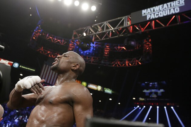 Floyd Mayweather Jr., celebrates his victory over Manny Pacquiao, from the Philippines,  in their welterweight title fight on Saturday, May 2, 2015 in Las Vegas. (AP Photo/Isaac Brekken)
