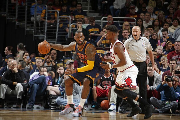 CLEVELAND, OH - APRIL 5:  LeBron James #23 of the Cleveland Cavaliers handles the ball against Jimmy Butler #21 of the Chicago Bulls on April 5, 2015 at Quicken Loans Arena in Cleveland, Ohio. NOTE TO USER: User expressly acknowledges and agrees that, by downloading and/or using this Photograph, user is consenting to the terms and conditions of the Getty Images License Agreement. Mandatory Copyright Notice: Copyright 2015 NBAE (Photo by Gregory Shamus/NBAE via Getty Images)