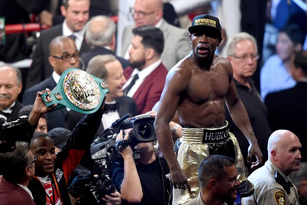 LAS VEGAS, NV - MAY 02:  Floyd Mayweather Jr. celebrates the unanimous decision victory during the welterweight unification championship bout on May 2, 2015 at MGM Grand Garden Arena in Las Vegas, Nevada.  (Photo by Harry How/Getty Images)