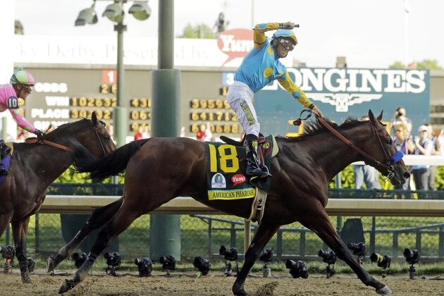 Victor Espinoza rides American Pharoah to victory in the 141st running of the Kentucky Derby horse race at Churchill Downs Saturday, May 2, 2015, in Louisville, Ky. (AP Photo/Morry Gash)