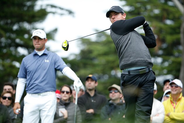 SAN FRANCISCO, CA - MAY 03:  Rory McIlroy of Northern Ireland hits his tee shot on the sixth hole as Gary Woodland looks on during their championship match in the World Golf Championships Cadillac Match Play at TPC Harding Park on May 3, 2015 in San Francisco, California.  (Photo by Christian Petersen/Getty Images)