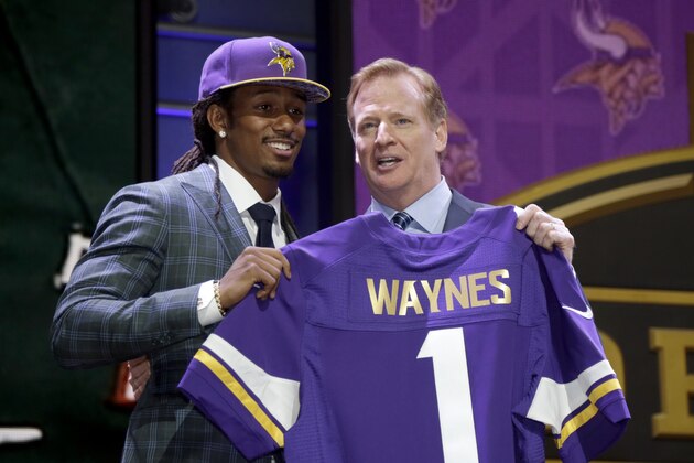 Trae Waynes stands on stage with NFL commissioner Roger Goodell, right, after being drafted 11th by the Minnesota Vikings in the first round of the 2015 NFL Draft, Thursday, April 30, 2015, in Chicago.  (Jeff Haynes/AP Images for Panini)