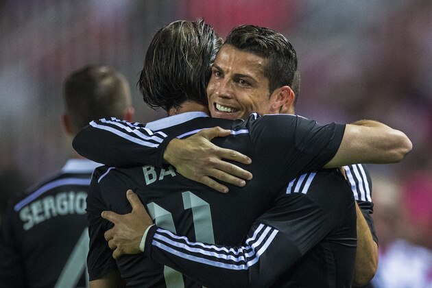 Real Madrid's Cristiano Ronaldo, right, celebrates his goal with Real Madrid's Gareth Bale, left, during a Spanish La Liga soccer match between Sevilla and Real Madrid at the Ramon Sanchez Pizjuan stadium in Sevilla, Spain, Saturday, May 2, 2015. (AP Photo/Andres Kudacki) Real Madrid's Cristiano Ronaldo, right, celebrates his goal with Real Madrid's Gareth Bale, left, during a Spanish La Liga soccer match between Sevilla and Real Madrid at the Ramon Sanchez Pizjuan stadium in Sevilla, Spain, Saturday, May 2, 2015. (AP Photo/Andres Kudacki)