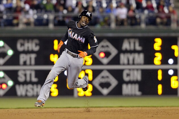 PHILADELPHIA - APRIL 22: Dee Gordon #9 of the Miami Marlins hits a three run triple in the eighth inning during a game against the Philadelphia Phillies at Citizens Bank Park on April 22, 2015 in Philadelphia, Pennsylvania. The Marlins won 6-1. (Photo by Hunter Martin/Getty Images)