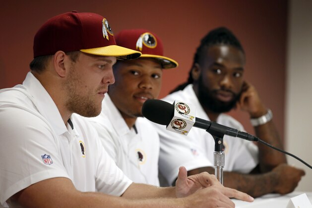 Washington Redskins NFL football draft picks, from left, offensive lineman Brandon Scherff, linebacker Preston Smith, running back Matt Jones, pause while answering questions during a media availability Saturday, May 2, 2015, in Landover, Md. (AP Photo/Alex Brandon)