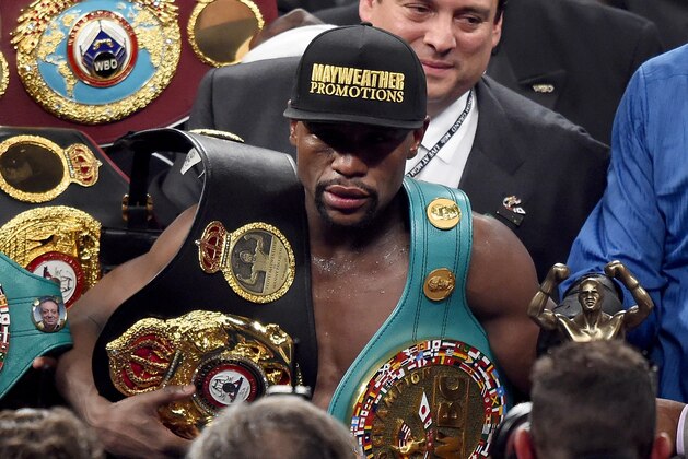 LAS VEGAS, NV - MAY 02:  Floyd Mayweather Jr. celebrates the unanimous decision victory during the welterweight unification championship bout on May 2, 2015 at MGM Grand Garden Arena in Las Vegas, Nevada.  (Photo by Harry How/Getty Images)