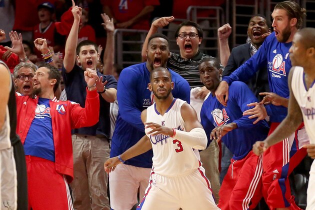 LOS ANGELES, CA - MAY 02:  Chris Paul #3 the Los Angeles Clippers and the Clippers bench react after Paul made a basket with one second remaining to give the Clippers the win against the San Antonio Spurs during Game Seven of the Western Conference quarterfinals of the 2015 NBA Playoffs at Staples Center on May 2, 2015 in Los Angeles, California.  The Clippers won 111-109 to win the series four games to three.  NOTE TO USER: User expressly acknowledges and agrees that, by downloading and or using this photograph, User is consenting to the terms and conditions of the Getty Images License Agreement.  (Photo by Stephen Dunn/Getty Images)