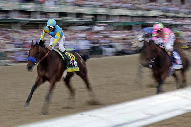 Victor Espinoza rides American Pharoah to victory in the 141st running of the Kentucky Derby horse race at Churchill Downs Saturday, May 2, 2015, in Louisville, Ky.  (AP Photo/Tim Donnelly)