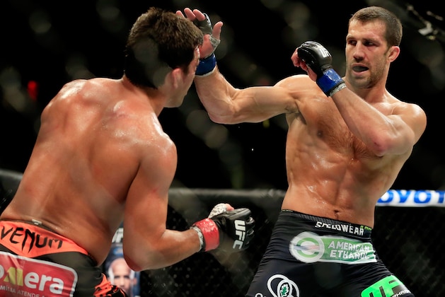 NEWARK, NJ - APRIL 18:  Luke Rockhold punches Lyoto Machida of Brazil in their middleweight bout during the UFC Fight Night event at Prudential Center on April 18, 2015 in Newark, New Jersey.  (Photo by Alex Trautwig/Getty Images)