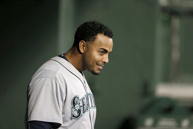 Seattle Mariners designated hitter Nelson Cruz watches play on the field from the dugout in the fourth inning of a baseball game against the Texas Rangers, Wednesday, April 29, 2015, in Arlington, Texas. (AP Photo/Tony Gutierrez)