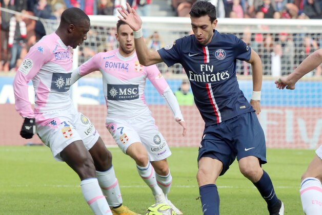 Paris Saint Germain's Javier Pastore, right, challenges for the ball with Evian's Kassim Mfoihaia, left, and Adrien Thomasson during their League One soccer match between Paris Saint Germain and Evian Thonon at Parc des Princes stadium, in Paris, Sunday, Jan. 18, 2015. (AP Photo/Jacques Brinon)