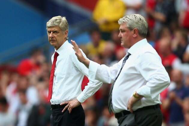 LONDON, ENGLAND - MAY 17:  Arsene Wenger manager of Arsenal and Steve Bruce, manager of Hull City look on during the FA Cup with Budweiser Final match between Arsenal and Hull City at Wembley Stadium on May 17, 2014 in London, England.  (Photo by Paul Gilham/Getty Images)