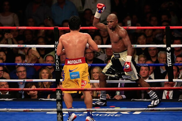 LAS VEGAS, NV - MAY 02:  Floyd Mayweather Jr. reacts in the twelfth round during the welterweight unification championship bout on May 2, 2015 at MGM Grand Garden Arena in Las Vegas, Nevada.  (Photo by Jamie Squire/Getty Images)