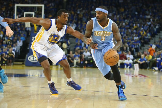 Apr 15, 2015; Oakland, CA, USA; Denver Nuggets guard Ty Lawson (3) dribbles the ball as Golden State Warriors forward Harrison Barnes (40) defends during the first quarter at Oracle Arena. Mandatory Credit: Kelley L Cox-USA TODAY Sports