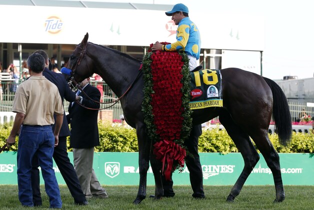 May 2, 2015; Louisville, KY, USA; Victor Espinoza aboard American Pharoah celebrates winning the 141st Kentucky Derby at Churchill Downs. Mandatory Credit: Brian Spurlock-USA TODAY Sports