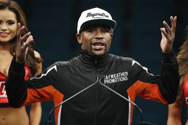 Floyd Mayweather Jr. gestures during a press conference following his welterweight title fight on Saturday, May 2, 2015 in Las Vegas. Mayweather defeated Manny Pacquiao in a unanimous decision. (AP Photo/John Locher)