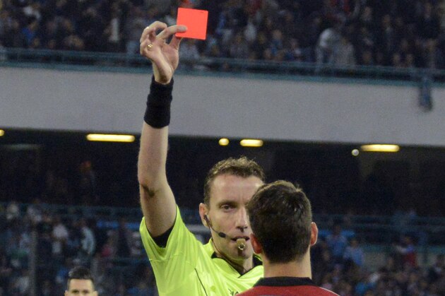 AC Milan's Mattia De Sciglio, right, receives a red card by referee Paolo Silvio Mazzoleni during a Serie A soccer match between Napoli and AC Milan, at the San Paolo stadium in Naples, Italy, Sunday, May 3, 2015. (AP Photo/Salvatore Laporta)