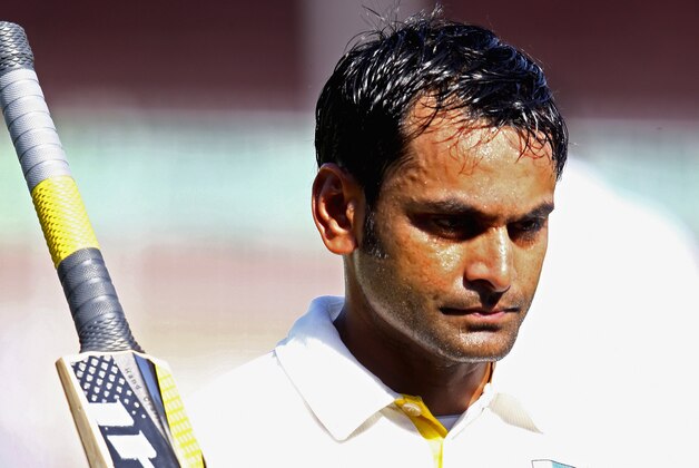 SHARJAH, UNITED ARAB EMIRATES - NOVEMBER 28:  Muhammad Hafeez of Pakistan leavess the field after being dismissed during day two of the third test between Pakistan and New Zealand at Sharjah Stadium on November 28, 2014 in Sharjah, United Arab Emirates.  (Photo by Francois Nel/Getty Images)