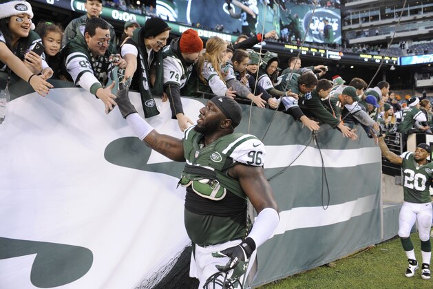 New York Jets' Muhammad Wilkerson  reacts with fans after an NFL football game against the Cleveland Browns Sunday, Dec. 22, 2013, in East Rutherford, N.J. The Jets won the game 24-13. (AP Photo/Bill Kostroun)