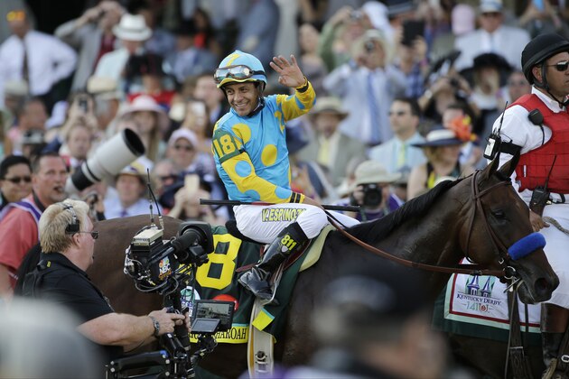 Victor Espinoza reacts after riding American Pharoah to victory in the 141st running of the Kentucky Derby horse race at Churchill Downs Saturday, May 2, 2015, in Louisville, Ky.  (AP Photo/Matt Slocum)