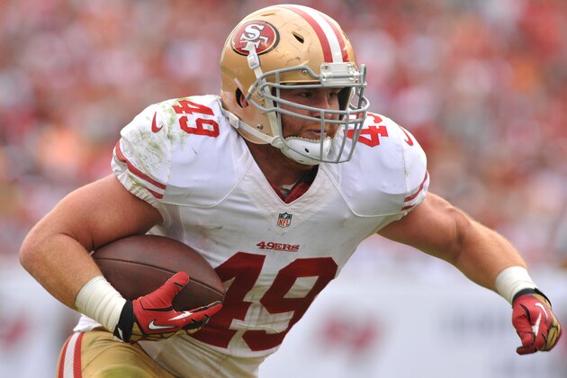 TAMPA, FL -  DECEMBER 15:  Fullback Bruce Miller #49 of the San Francisco 49ers runs upfield against the Tampa Bay Buccaneers December 15, 2013 at Raymond James Stadium in Tampa, Florida. (Photo by Al Messerschmidt/Getty Images)