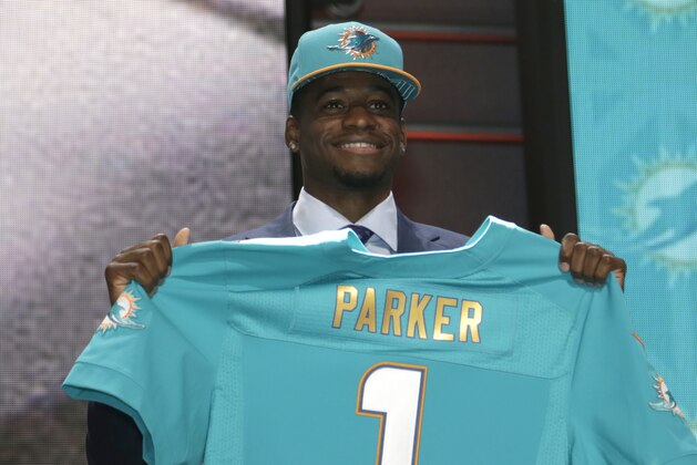 Devante Parker stands on stage after being drafted 14th by the Miami Dolphins in the first round of the 2015 NFL Draft, Thursday, April 30, 2015, in Chicago.  (Jeff Haynes/AP Images for Panini)