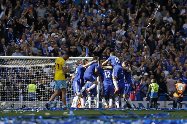 Chelsea players celebrate after the English Premier League soccer match between Chelsea and Crystal Palace at Stamford Bridge stadium in London, Sunday, May 3, 2015.  Chelsea won the match 1-0 to secure Premier League title with 3 games to spare.  (AP Photo/Kirsty Wigglesworth)