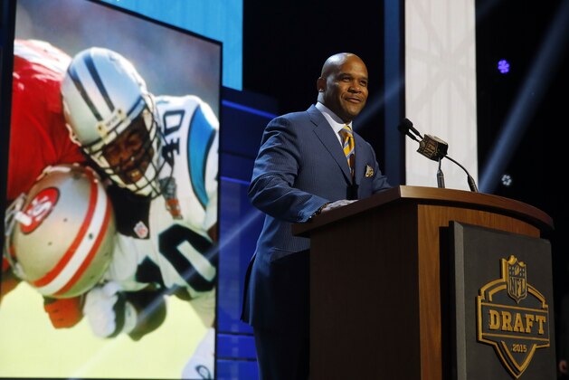 Former NFL player Pat Terrell announces that the Carolina Panthers selects Michigan wide receiver Devin Funchess as the 41st pick in the second round of the 2015 NFL Football Draft,  Friday, May 1, 2015, in Chicago. (AP Photo/Charles Rex Arbogast)