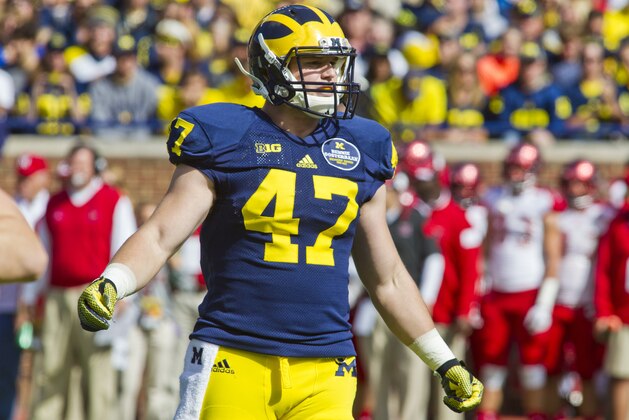 Michigan linebacker Jake Ryan (47) looks to his sideline for instructions between downs in the first quarter of an NCAA college football game against Miami (Ohio) in Ann Arbor, Mich., Saturday, Sept. 13, 2014. (AP Photo/Tony Ding)