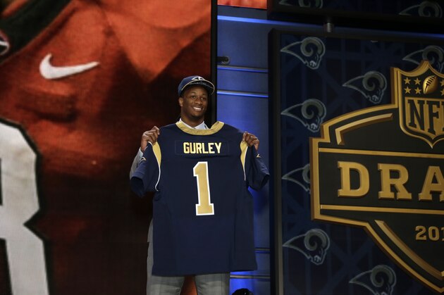 Todd Gurley stands on stage after being drafted tenth by the St. Louis Rams in the first round of the 2015 NFL Draft, Thursday, April 30, 2015, in Chicago.  (Jeff Haynes/AP Images for Panini)