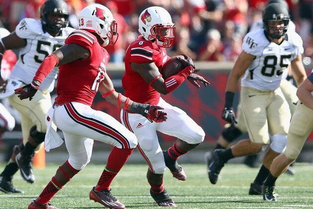 LOUISVILLE, KY - SEPTEMBER 27:  Gerod Holliman #8 of the Louisville Cardinals runs with the ball after intercepting a pass during the game against the Wake Forest Demon Deacons at Papa John's Cardinal Stadium on September 27, 2014 in Louisville, Kentucky.  (Photo by Andy Lyons/Getty Images)