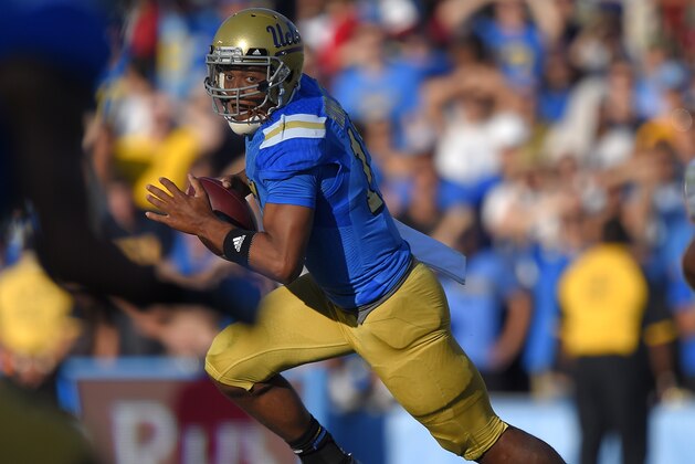 UCLA quarterback Brett Hundley gets set to pass during the second half of an NCAA college football game against Stanford, Friday, Nov. 28, 2014, in Pasadena, Calif. Stanford won 31-10. (AP Photo/Mark J. Terrill)