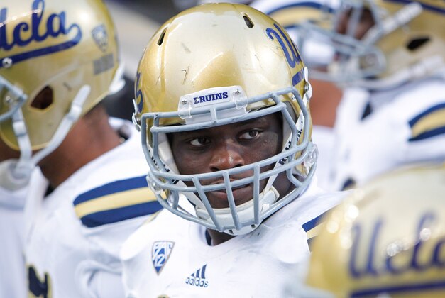 Nov 8, 2014; Seattle, WA, USA; UCLA Bruins defensive lineman Owamagbe Odighizuwa (94) stands with his teammates before a game against the Washington Huskies at Husky Stadium. Mandatory Credit: Joe Nicholson-USA TODAY Sports